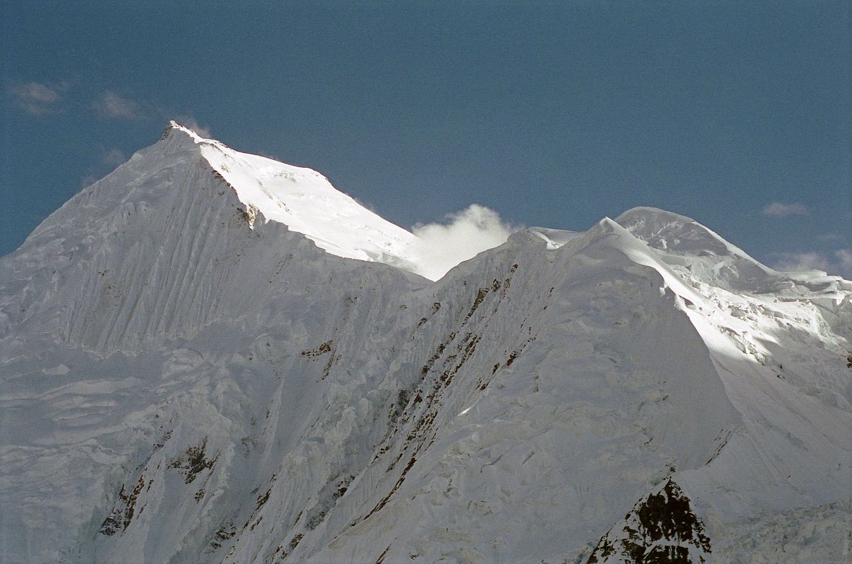 14 Chogolisa Late Afternoon From Shagring Camp On Upper Baltoro Glacier The southwest summit Chogolisa I (7665m) is on the left and the northeast summit Chogolisa II (7654m) is on the right, seen from Shagring camp on the Upper Baltoro Glacier. In 1909, a party led by Duke of the Abruzzi reached 7500m before being stopped by bad weather. Hermann Buhl and Kurt Diemberger attempted Chogolisa in 1957 after they had successfully summited Broad Peak a few weeks earlier. On June 25 they left camp I and camped in a saddle at 6706m on the southwest ridge. Bad weather forced them to retreat and on June 27 Buhl fell through a cornice and disappeared. His body has never been found.